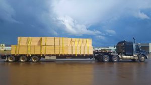 Flat deck truck with a stormy backdrop