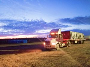 Truck driving through sunrise